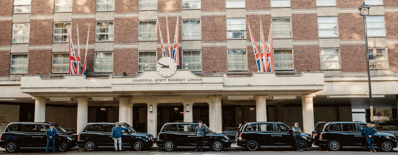 Taxi lineup at Hyatt Regency Churchill, front entrance, London Highlights corporate tour start.