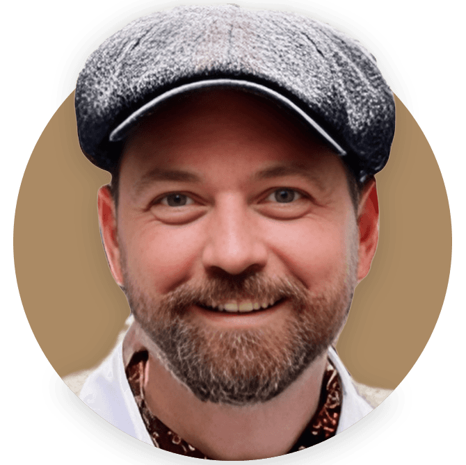 Jack Harris the founder of TallyHo.com smiling and wearing a tweed cap. 