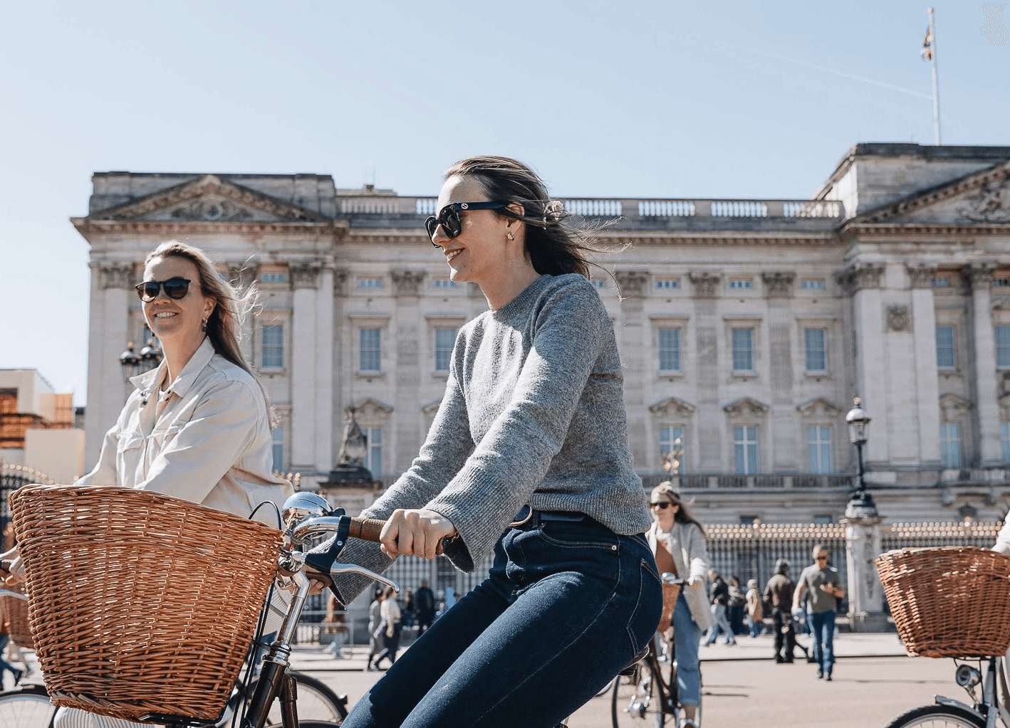 Tally Ho guests riding Pashley bicycles in front of Buckingham Palace 