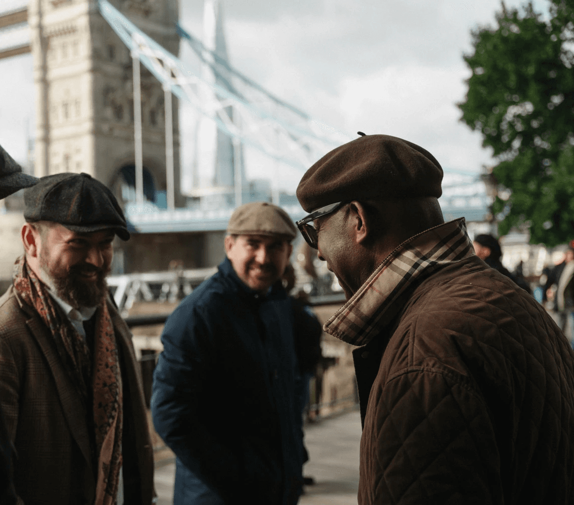 A private Tally Ho London tour stops for photographs by Tower Bridge 