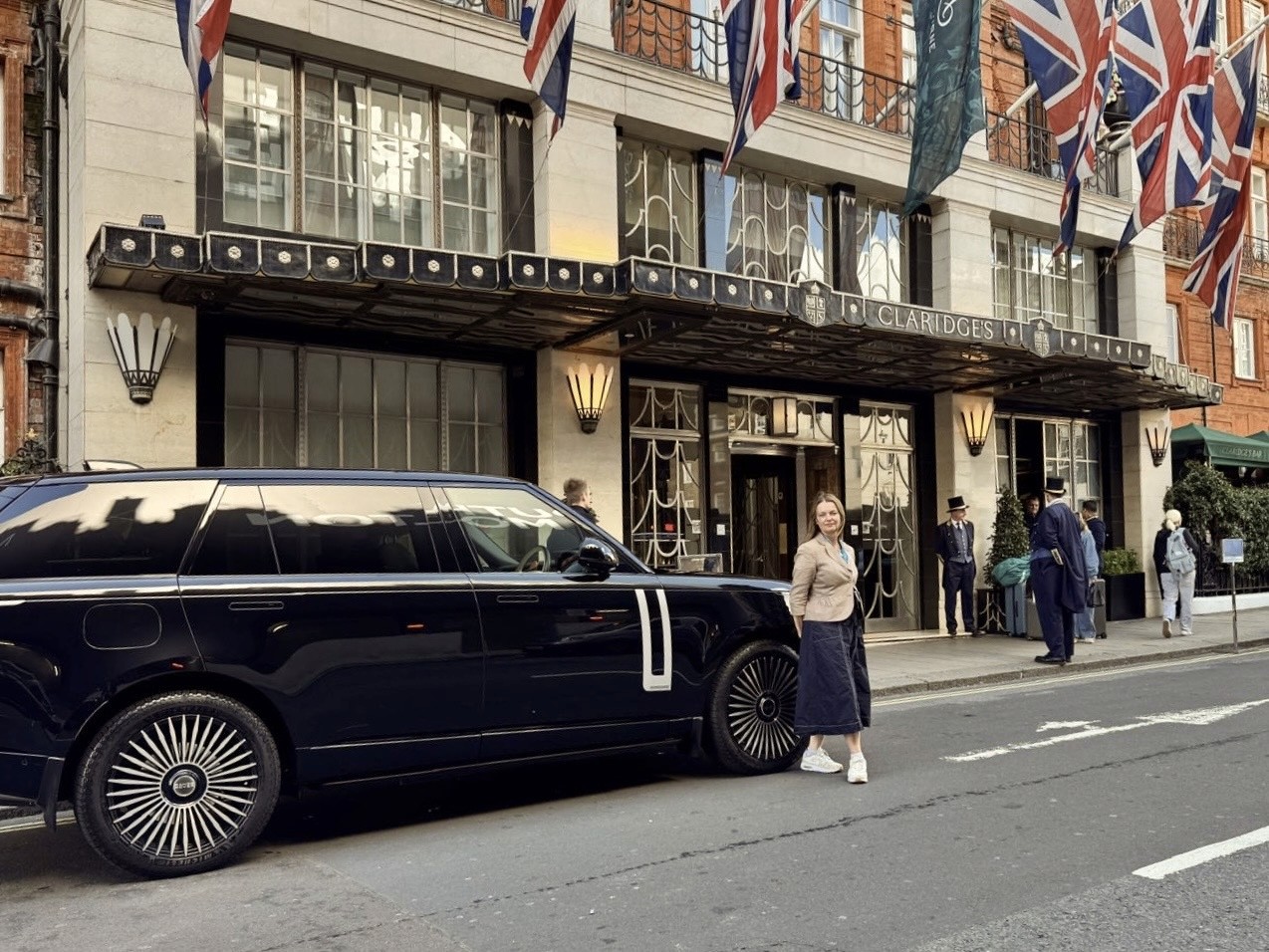 A Range Rover and tour guide outside of Claridge's Hotel in London 