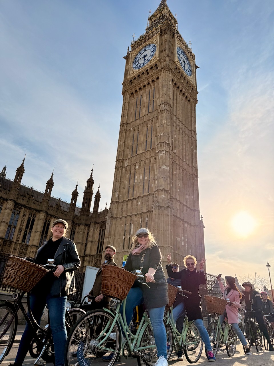 A corporate bike tour group cycling underneath Big Ben in London